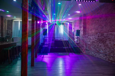 The laser rig firing across the empty floor